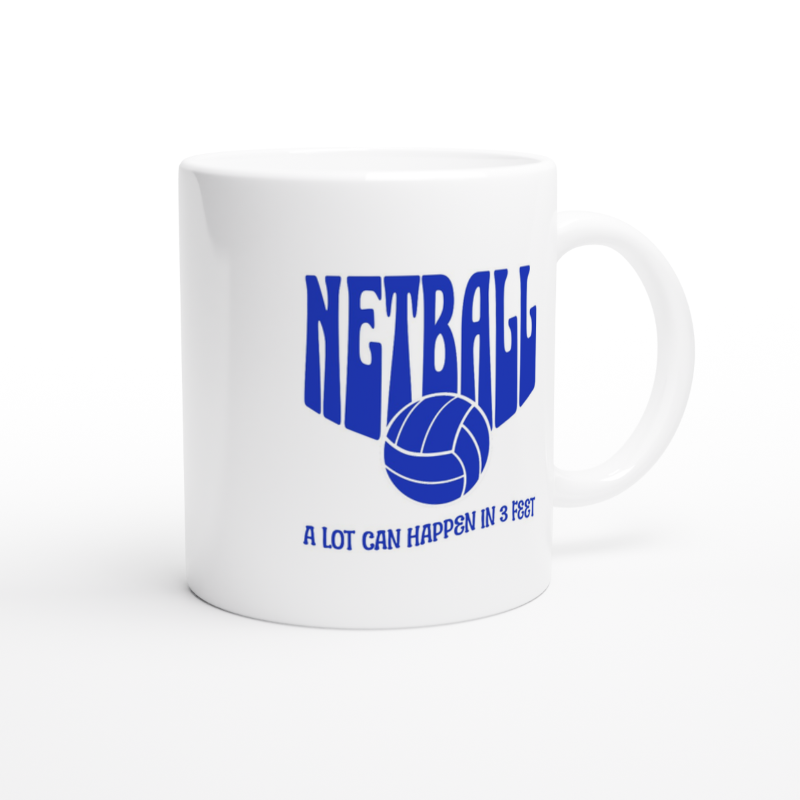 White ceramic mug with netball a lot can happen in three feet blue text