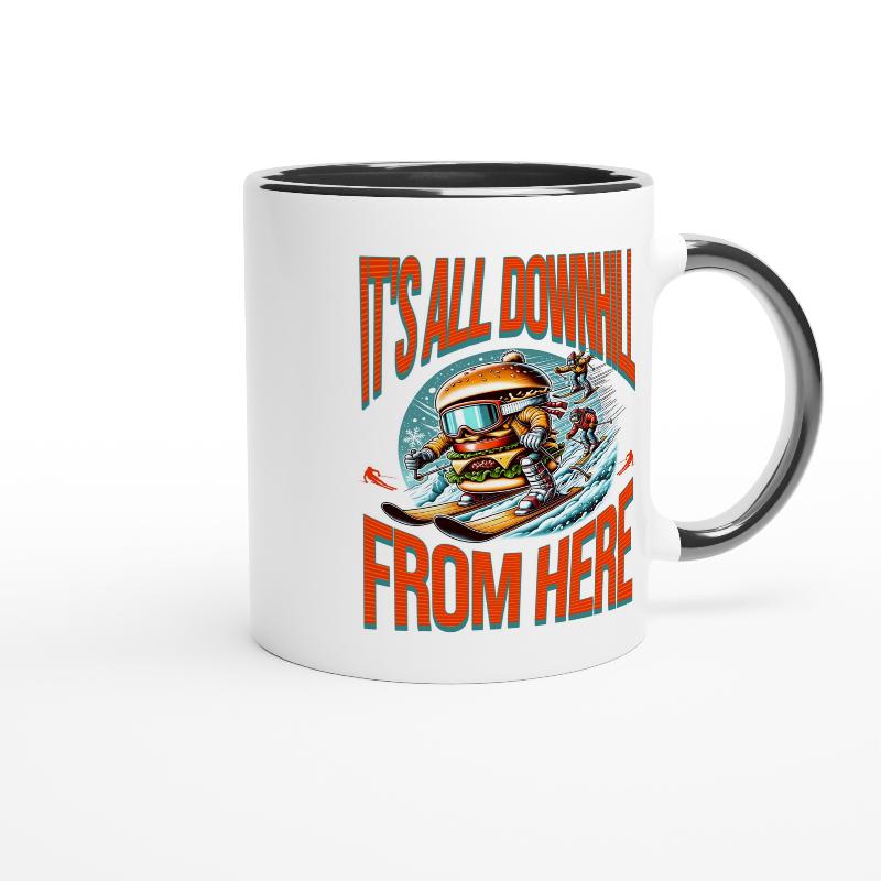 White ceramic mug black handle with a skiing burger and bold orange text It's All Downhill From Here