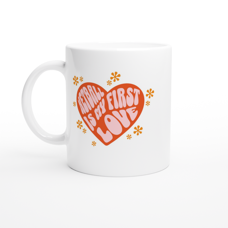 White Mug With Netball is my first love pink writing in red heart with yellow flowers