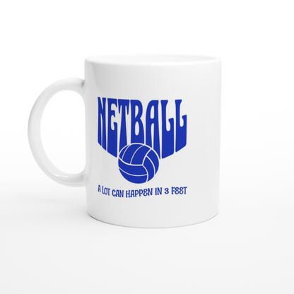 White ceramic mug with netball a lot can happen in three feet blue text