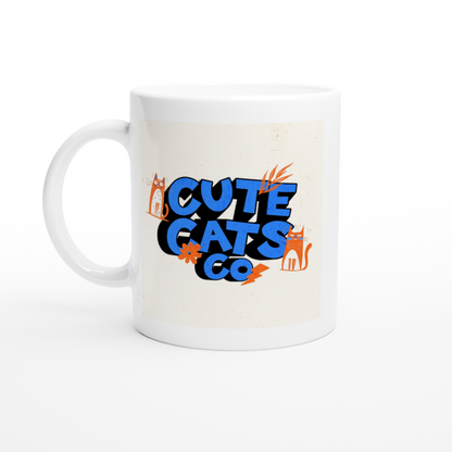 White ceramic mug with cute cats co lettering in blue and orange