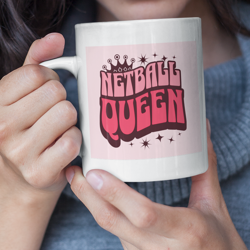 white ceramic mug pink graphics