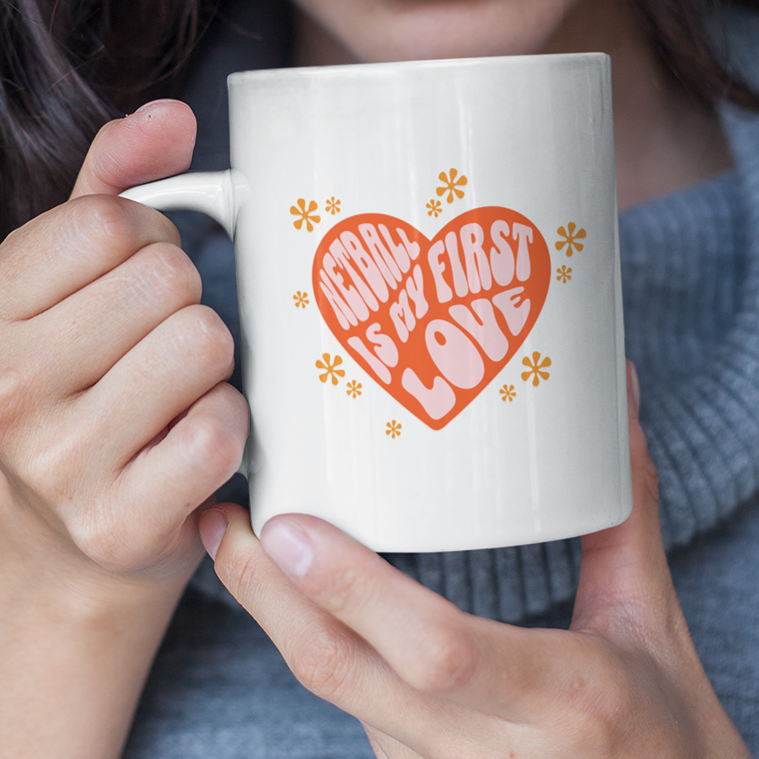 white ceramic mug yellow flowers pink and red 
