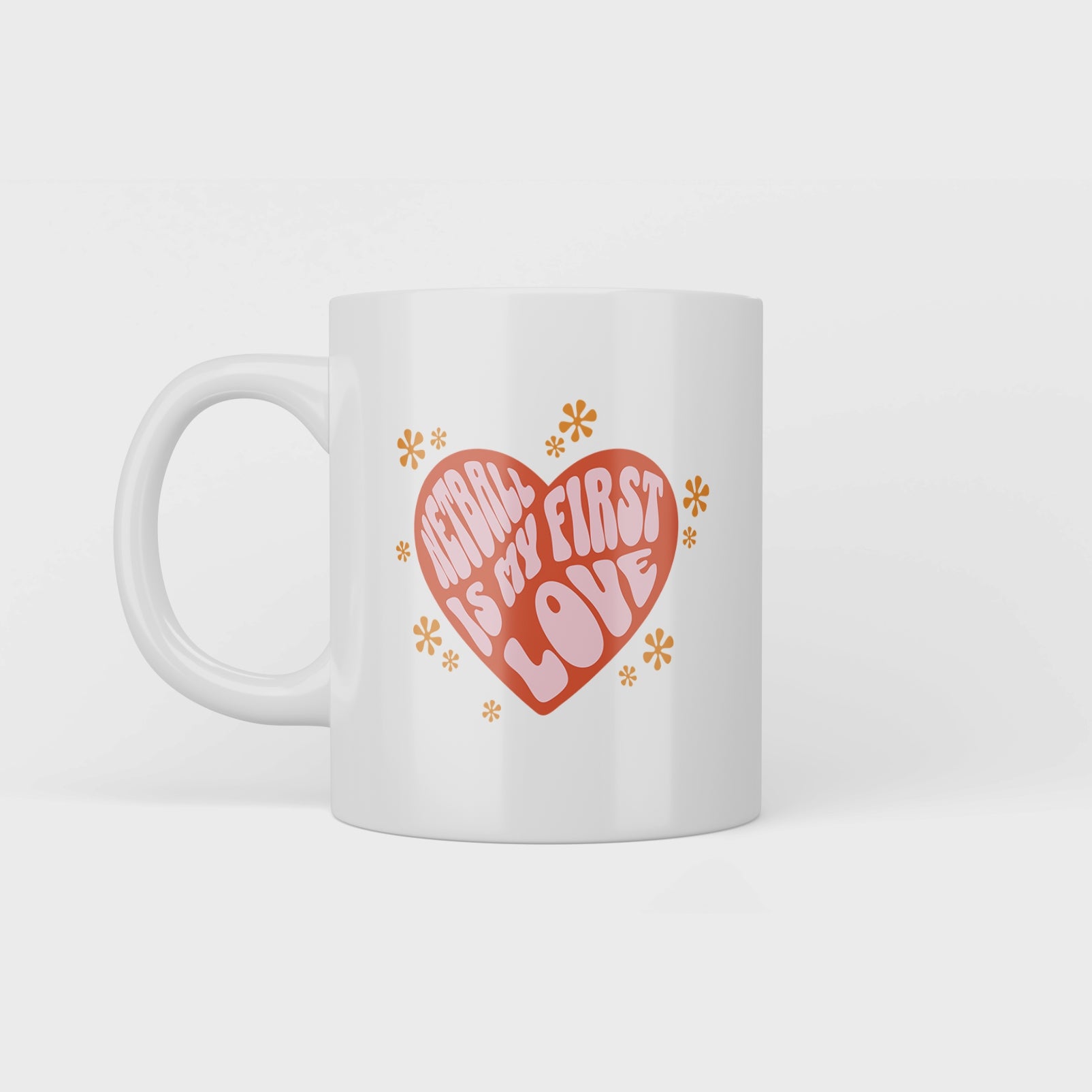 Video of White Mug With Netball is my first love pink writing in red heart with yellow flowers